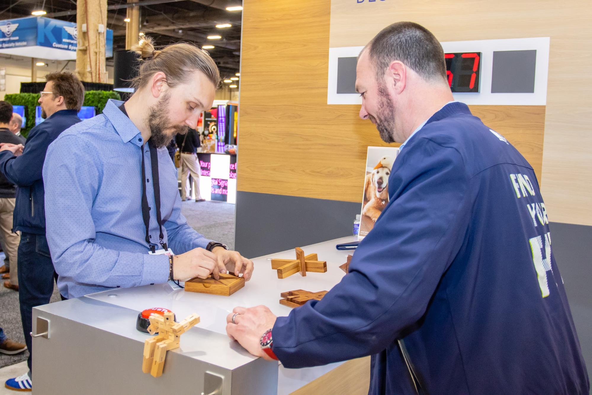 Visitors doing wooden puzzles