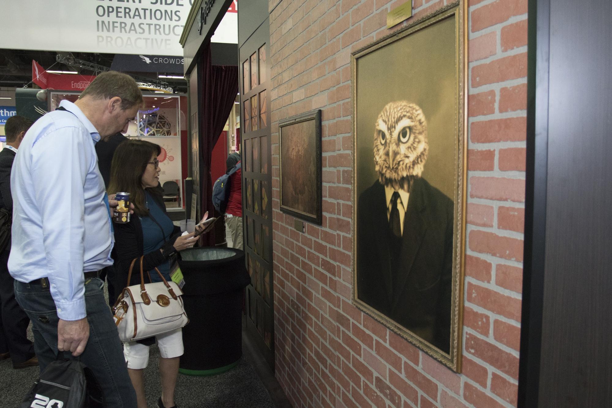 Visitors looking at paintings